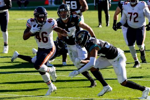 Chicago Bears running back Artavis Pierce (46) stiff arms Jacksonville Jaguars cornerback Greg Mabin (34) in the fourth quarter at TIAA Bank Field on Sunday in Jacksonville. (MATT PENDLETON/TNS)