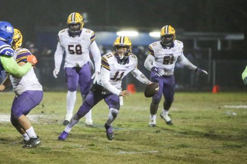 Columbia quarterback Jordan Smith scrambles out of the pocket against Robert E. Lee during Friday’s Region 1-6A semifinal. (BRENT KUYKENDALL/Lake City Reporter) 