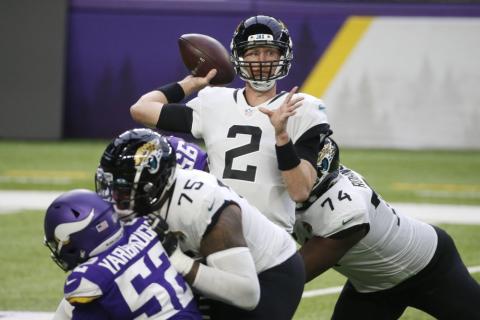 Jacksonville Jaguars quarterback Mike Glennon throws a pass against the Minnesota Vikings on Dec. 6 in Minneapolis. (BRUCE KLUCKHOHN/Associated Press)