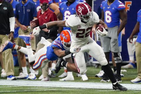 Florida linebacker Mohamoud Diabate (11) hits Alabama running back Najee Harris (22) during the second half of the Southeastern Conference championship on Saturday in Atlanta. (JOHN BAZEMORE/Associated Press)