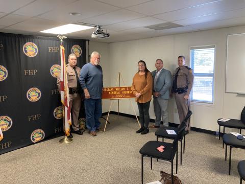 A stretch of Interstate 75 was designated the Sergeant William T. Bishop Memorial Highway on Tuesday. Present for the dedication for the late Florida Highway Patrol trooper were Colonel Gene Spaulding, FHP director (from left); Charles Barnes, Bishop’s brother-in-law; Vanessa Barnes, Bishop’s sister; Chuck Brannan, District 10 state representative; and FHP Lt. Colonel Troy Thompson. (COURTESY)