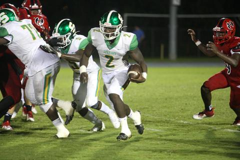 Suwannee quarterback Jaquez Moore scrambles up the field against Hamilton County on Sept. 11. (PAUL BUCHANAN/Special to the Reporter)