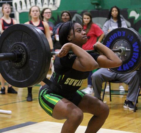 Suwannee’s Tyra Kalandyk lifts during the clean and jerk portion of a meet last season at Suwannee High School. SHS hosts its annual Power of Christmas event today. (PAUL BUCHANAN FILE/Special to the Reporter)