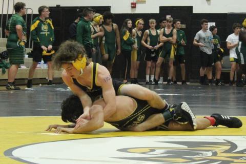 Columbia’s Brett Millard wrestles against Buchholz in a preseason match last month. (COURTESY)