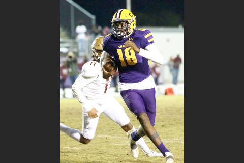 Columbia’s Marcus Peterson scrambles up the field  against St. Augustine during Friday’s Region 1-6A final. (JEN CHASTEEN/Special to the Reporter)