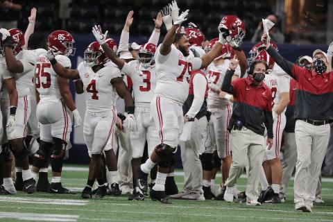 Nick Saban and Alabama players react after running back Najee Harris scored a touchdown against Florida during the fourth quarter of the SEC Championship game Saturday. (Curtis Compton/Atlanta Journal-Constitution/TNS)
