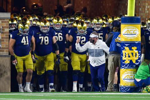 Notre Dame head coach Brian Kelly, leading the Fighting Irish out of the tunnel before a game against Clemson at Notre Dame Stadium on Nov. 7, 2020, in South Bend, Indiana, was named the Atlantic Coast Conference Coach of the Year. (MATT CASHORE/Pool/Getty Images/TNS)
