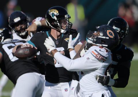 Jaguars quarterback Mike Glennon (2) looks for a target while under pressure during second quarter action against the Chicago Bears on Dec. 27 in Jacksonville. (BOB SELF/TNS)