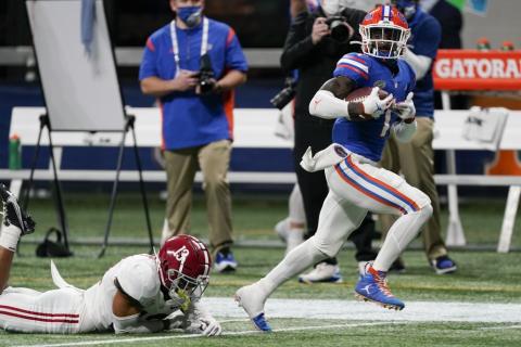 Florida wide receiver Kadarius Toney (1) runs for a touchdown after a catch during the first half of the Southeastern Conference championship game against Alabama on Dec. 19 in Atlanta. (JOHN BAZEMORE/Associated Press)