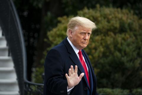 President Donald Trump waves as he departs on the South Lawn of the White House on Dec. 12 in Washington, D.C. (AL DRAGO/Getty Images/TNS)