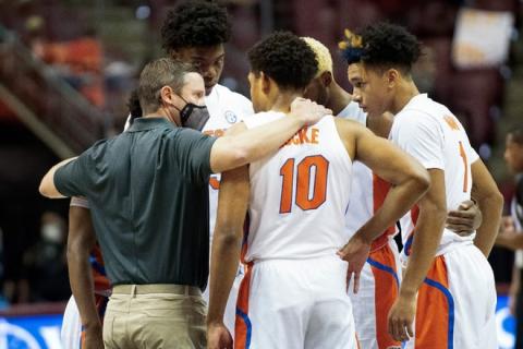 The Florida Gators huddle with coach Mike White after Keyontae Johnson collapsed during Saturday's game in Tallahassee. (MIGUEL OLIVELLA/Courtesy of ACC)