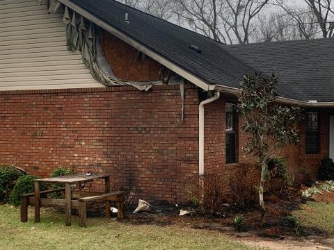 A home off 152nd Street in western Suwannee County sustained minor damage Wednesday after a heat lamp sparked a fire outside the house. (COURTESY SUWANNEE FIRE RESCUE)