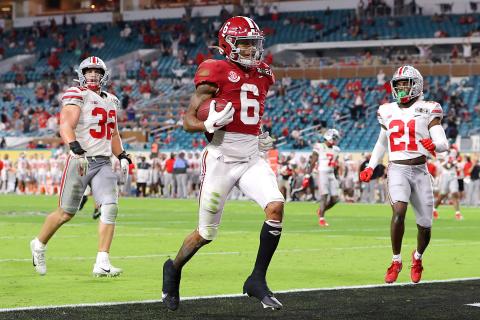 Alabama Crimson Tide receiver DeVonta Smith rushes for a 42-yard touchdown against the Ohio State Buckeyes during the College Football Playoff National Championship game on Monday in Miami Gardens. (KEVIN C. COX/Getty Images/TNS)