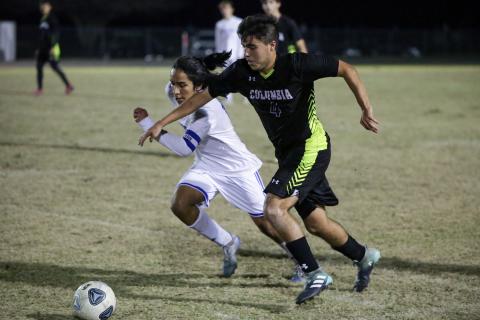 Columbia’s Marcos Medina-Rodriguez chases down possession of the ball against Keystone Heights on Monday night. (BRENT KUYKENDALL/Lake City Reporter) 