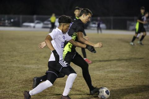Gainesville’s Elesio Perez chases after possession from Columbia’s Bryant Rigdon on Tuesday night. (BRENT KUYKENDALL/Lake City Reporter)