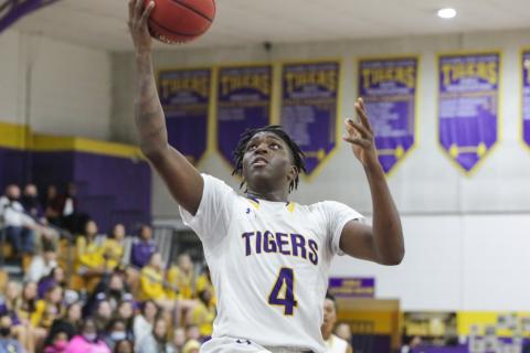 Columbia forward Marcus Peterson rises to score against Baker County on Jan. 22. (BRENT KUYKENDALL/Lake City Reporter)