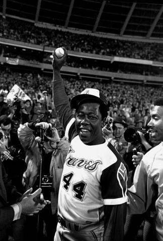 Hank Aaron celebrates after his 715th career home run in 1974. (AP FILE PHOTO)