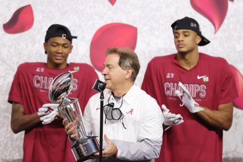 Alabama Crimson Tide coach Nick Saban raises the Leishman Trophy after defeating the Notre Dame Fighting Irish 31-14 in the College Football Playoff Semifinal at the Rose Bowl Game at AT&T Stadium on Jan. 1 in Arlington, Texas. (CARMEN MANDATO/Getty Images/TNS)