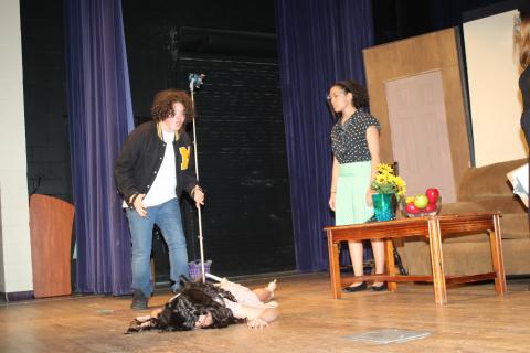 Nick Stewart reacts to Rose Brocchi playing a dead woman during dress rehearsal for the Columbia High dinner/theater production of ‘The Bold, the Young, and the Murdered.’ The CHS drama club and culinary arts program will host the play tonight and tomorrow at the Norman L. Choice Performing Arts Center. (TONY BRITT/Lake City Reporter)