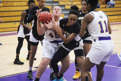Columbia forward Amaiya Callum and Oakleaf forward Fantasia James fight for the ball during Friday’s game. (JORDAN KROEGER/Lake City Reporter)