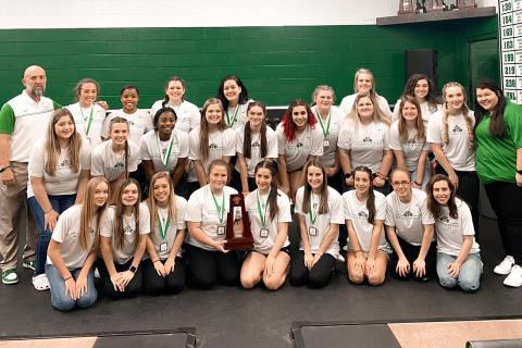 Suwannee’s girls weightlifting team poses with the Region 1-1A trophy on Friday. (COURTESY)