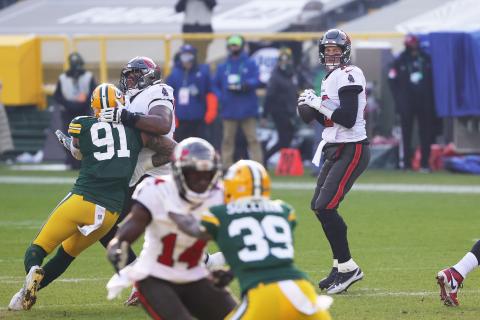 Tampa Bay Buccaneers quarterback Tom Brady looks to pass in the first quarter against the Green Bay Packers during the NFC Championship game on Sunday at Lambeau Field in Green Bay, Wisconsin. (STACY REVERE/Getty Images/TNS)