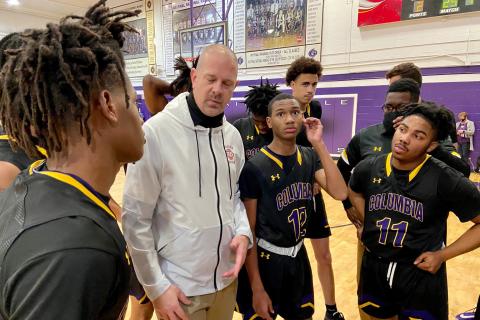 Columbia coach Steve Faulkner listens to senior Dante Brown during a second-half huddle Tuesday night. (SCOTT LAPEER/Special to the Reporter)