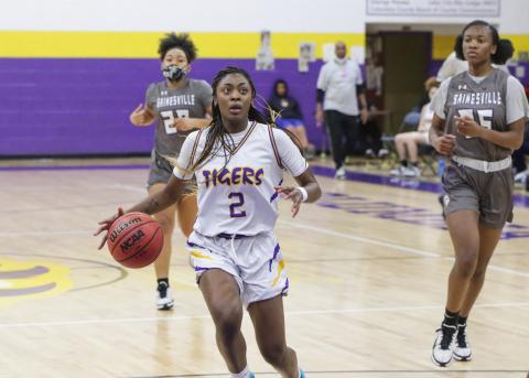 Columbia guard Na’Haviya Paxton pulls up for a shot against Gainesville during Wednesday’s District 2-6A semifinals. (BRENT KUYKENDALL/Lake City Reporter)