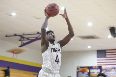 Columbia forward Marcus Peterson goes up for a shot against Santa Fe on Feb. 4.  Peterson scored 32 points in Thursday’s 96-73 win over Tate in the Region 1-6A quarterfinals. (BRENT KUYKENDALL/Lake City Reporter)