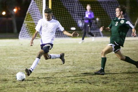 Columbia’s Daniel Lee passes the ball up the field against Lincoln during the District 2-6A championship game on Feb. 8. (BRENT KUYKENDALL/Lake City Reporter)