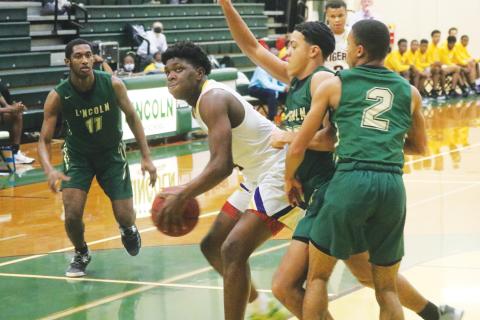 Columbia forward Marcus Peterson looks to shoot against Lincoln during the District 2-6A championship on Feb. 12. (JORDAN KROEGER/Lake City Reporter)