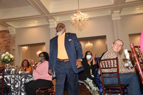 Carlos Brown is cheered as he prepares to accept his award as the Columbia County School District’s School-Related Employee of the Year at a luncheon at The Blanche last week. (COURTESY)
