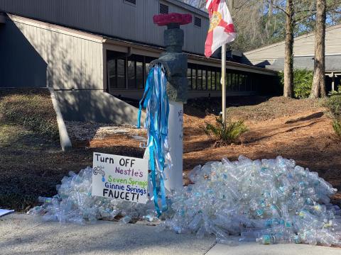 A demonstration set up by protesters Tuesday morning at the Suwannee River Water Management District headquarters against Seven Springs Company’s request for a permit renewal to withdraw nearly one million gallons a water a day from Ginnie Springs. (COURTESY)