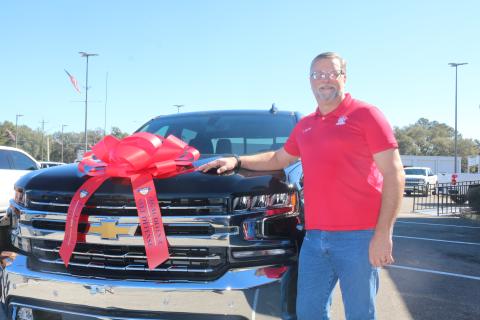 Don Meyer, a law enforcement officer and a concealed weapons instructor, won a 2021 Chevrolet Silverado in a registration contest from Legal Defense U.S. Law Shield. Meyer received the truck Wednesday at Rountree-Moore Chevrolet. (TONY BRITT/Lake City Reporter)