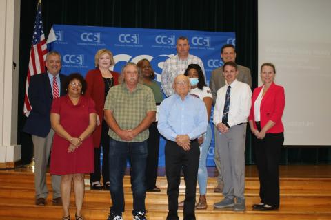 Columbia County school district staffers were honored after they saved maintenance department worker Jim Osburn last year after he fell off a ladder. The brief recognition ceremony took place Tuesday night during the school board meeting. Narrie Smith (front row, from left) Osburn and Keith Hudson. (Back row, from left) Lex Carswell, Stephanie Johns, Phyllisteen Reese, Casey Starling, Sandra Bing, Steve Nelson, Robert Cooper and Dana Brady-Giddens. (TONY BRITT/Lake City Reporter)