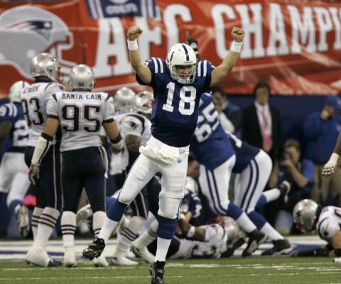 Indianapolis Colts quarterback Peyton Manning (18) celebrates running back Joseph Addai's three-yard touchdown run in the fourth quarter of the AFC Championship game against the New England Patriots on Jan. 21, 2007, in Indianapolis. (AP FILE PHOTO)