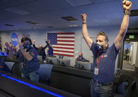 In this photo provided by NASA, members of NASA's Perseverance rover team react in mission control after receiving confirmation the spacecraft successfully touched down on Mars at NASA's Jet Propulsion Laboratory on Thursday in Pasadena, Calif. The landing of the six-wheeled vehicle marks the third visit to Mars in just over a week. Two spacecraft from the United Arab Emirates and China swung into orbit around the planet on successive days last week. (COURTESY OF NASA)