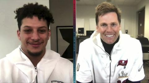 In this still image from video provided by the NFL, Kansas City Chiefs quarterback Patrick Mahomes, left, and Tampa Bay Buccaneers quarterback Tom Brady speak during Opening Night for Super Bowl 55 on Monday. (NFL)