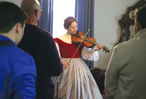 Emily-Jane Curtis, a dual-enrolled student at North Florida Community College, plays Civil War-era songs on her viola during Saturday’s ‘Blast Through the Past’ event at the Lake City-Columbia County Historical Museum. (MORGAN MCMULLEN/Lake City Reporter)