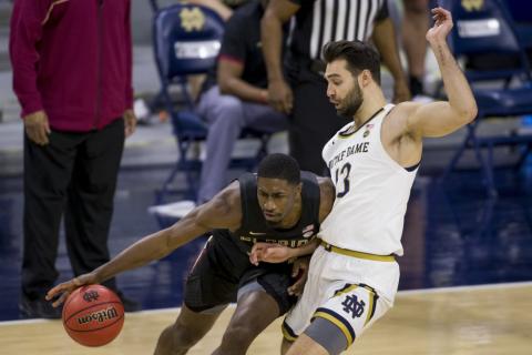 Florida State's Sardaar Calhoun, left, drives in as Notre Dame's Nikola Djogo (13) defends during the second half Saturday in South Bend, Ind. Notre Dame won 83-73. (ROBERT FRANKLIN/Associated Press)