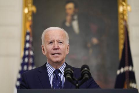 President Joe Biden speaks in the State Dining Room of the White House on Saturday in Washington. The Senate approved a sweeping pandemic relief package over Republican opposition on Saturday, moving Biden closer to a milestone political victory that would provide $1,400 checks for most American and direct billions of dollars to schools, state and local governments, and businesses. (ALEX BRANDON/Associated Press)