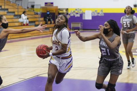 Columbia guard Na'Haviya Paxton drives to the basket to score against Gainesville during the District 2-6A semifinals on Feb. 3. (BRENT KUYKENDALL/Lake City Reporter)