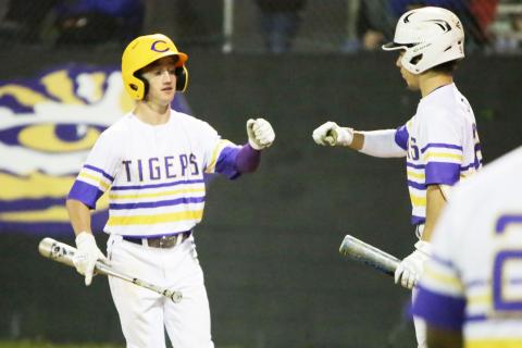 Columbia’s Matthew Dumas fist bumps with Cole Williams after scoring a run against Stanton on Tuesday night. (BRENT KUYKENDALL/Lake City Reporter)
