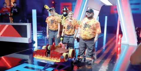 Lake City’s Brian Boatright (right) competed with Team Extinguisher on BattleBots in the 2020 season. John Flaacke IV (second from right) is the team’s captain and his father John III and brother Ben were also on the team. (COURTESY)