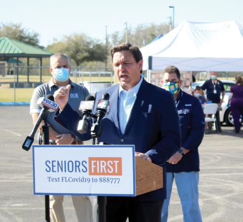 Gov. Ron DeSantis speaks to the media during a Thursday morning press conference at Southside Sports Complex, where he gave an update regarding the state’s covid vaccine effort. (TONY BRITT/Lake City Reporter)