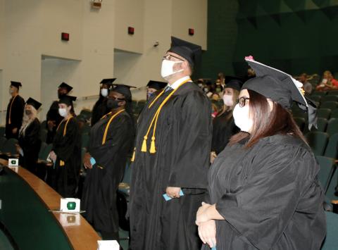 Florida Gateway College graduates await the start of their commencement ceremony in December. The college is continuing to hold small group graduation exercises this spring. (FILE)