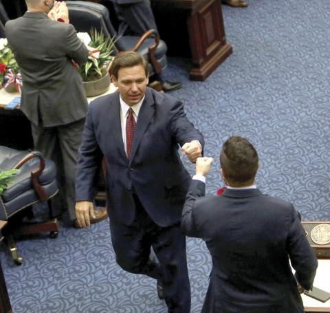 Gov. Ron DeSantis exits after delivering the State of the State address during the joint session of the Florida Legislature at the Capitol in Tallahassee on Tuesday. (IVY CEBALLO/Tampa Bay Times/TNS)