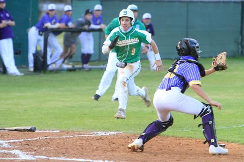 Suwannee’s Tyson Greene beats out a throw at home plate to score a run as Columbia catcher Grant Bowers gets set to catch the ball Tuesday night. (PAUL BUCHANAN/Special to the Reporter)