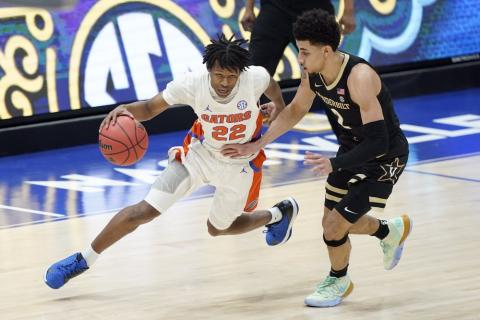 Florida's Tyree Appleby (22) drives against Vanderbilt's Scotty Pippen Jr. (2) during the SEC Tournament on Thursday in Nashville, Tenn. (MARK HUMPHREY/Associated Press)