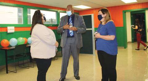 NorthStar Family Resource Center manager Philip Mobley (center) gives a tour of the facilities at the Richardson Community Center.